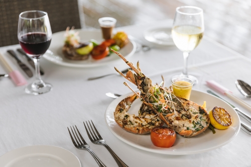 A set table with lobster served as the main course.