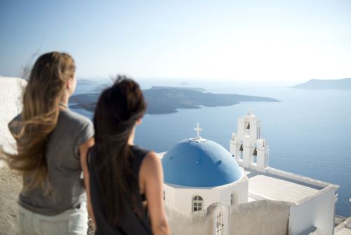 Two young travellers enjoying the views of Santorini 