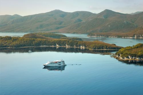 The Coral Expeditions cruise ship at Bramble Cove in Port Davey