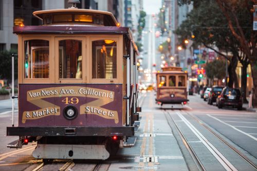 Old-school cable cars on city street in San Francisco