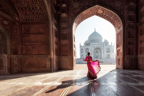 Woman in red sari at Taj Mahal