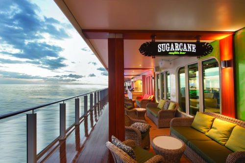 Some cosy wicker lounges in front of the Sugarcane bar overlooking the sea aboard the NCL vessel. 