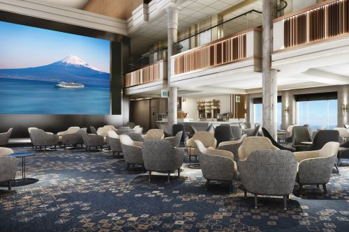 The Atrium aboard NCL's vessels featuring a big screen, balconies and some seats all held in grey and blue colours.