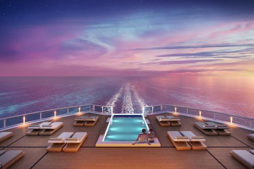 The back of the ship featuring the sundeck with some lounges and a couple sitting by the infinity pool enjoying the dusk