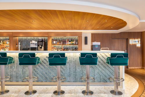 The contemporary architecture of the Waves Bar kept in shades of brown and turquoise. 