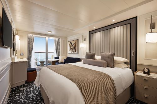 The Veranda stateroom abord the Oceania vessel kept in shades of grey and brown 