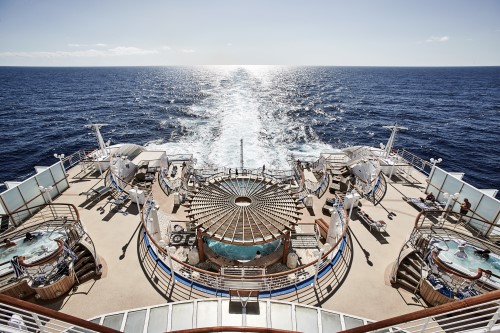 Back pool deck of the Diamond Princess cruise ship with the ocean in the background 