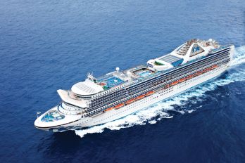 A drone shot of the Grand Princess cruising in the ocean