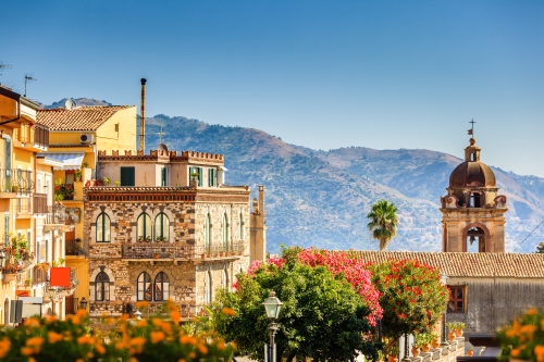 A charming hilltop town in Sicily, with medieval buildings and breathtaking views of the surrounding hills