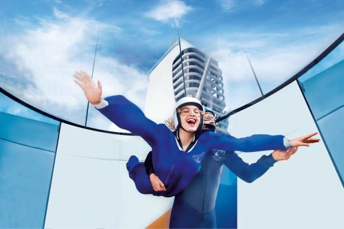 A woman trying out the iFly skydive simulator aboard the Royal Caribbean vessel 