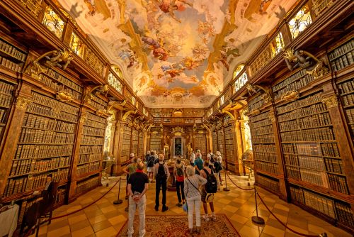 The Mel library from inside characterized by grandeur and elegance, featuring ornate Baroque architecture and intricately decorated ceilings