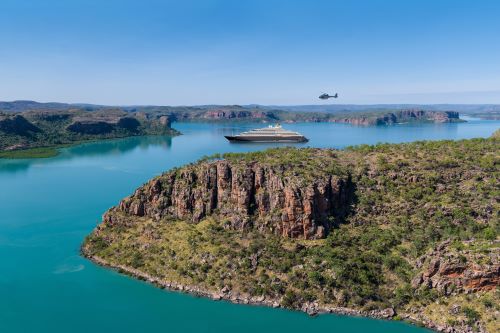 The Scenic vessel anchored close to the Kimberley gorges with the helicopter going on scenic flights