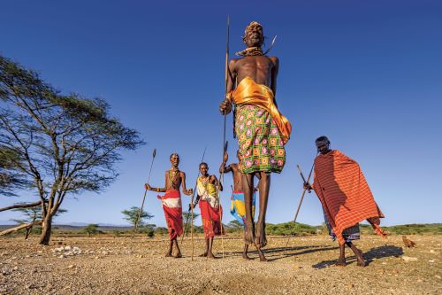 Warrior from Samburu tribe performing traditional jumping dance in Kenya