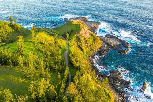 Aerial view of waves crushing against the scenic coast of Norfolk Island