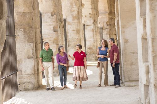 Viking Cruises tour guide walking through Arles with four guests on walking tour