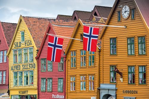 Norwegian Houses in a row with the flag of Norway on two houses 