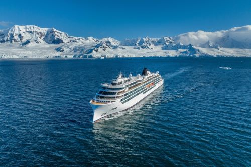 A Viking expedition ship cruising through Antarctica with ice landscapes in the background 