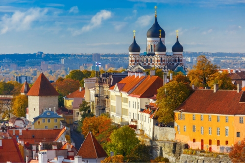 A majestic church surrounded by red-roofed buildings