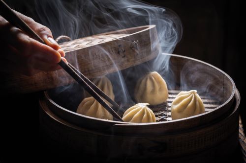 A close up of deliciously steaming dumplings