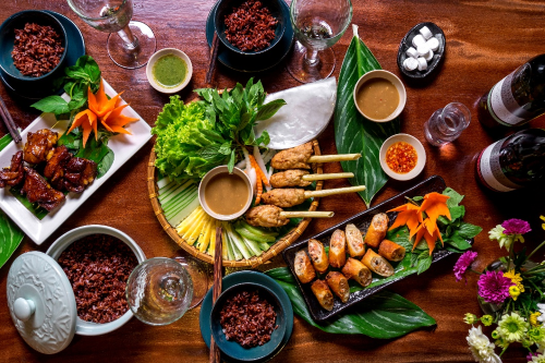 A top-down photo of a set table with delicious Vietnamese food
