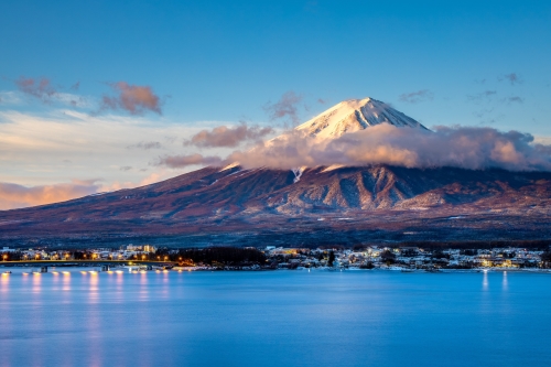 The majestic, symmetrical Mt Fuji volcano with a snow-capped pea. 