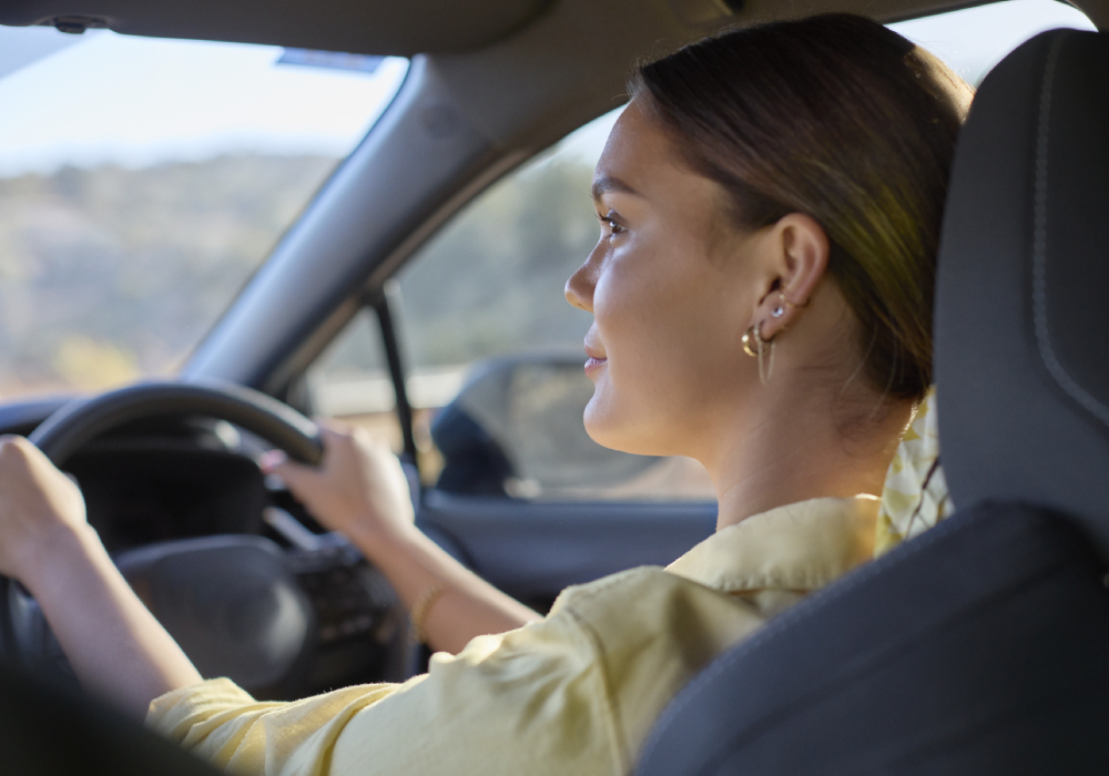 Young girl driving car