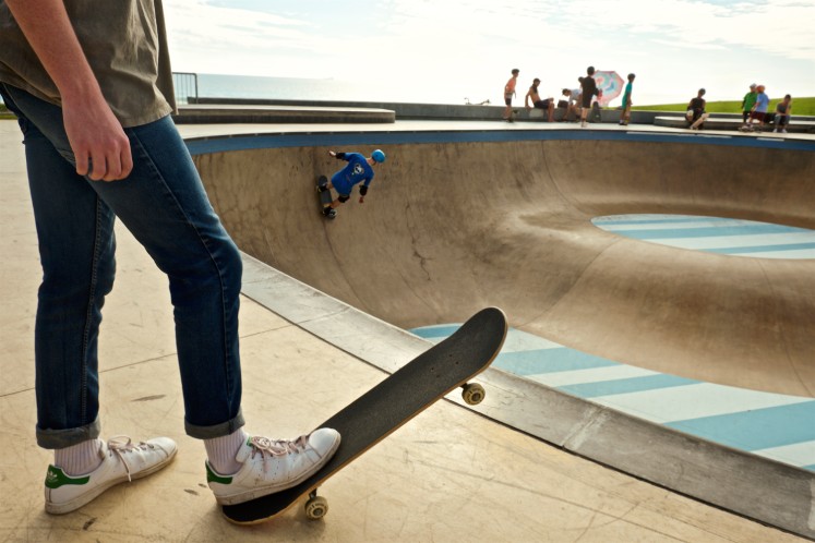 Teen riding a skateboard