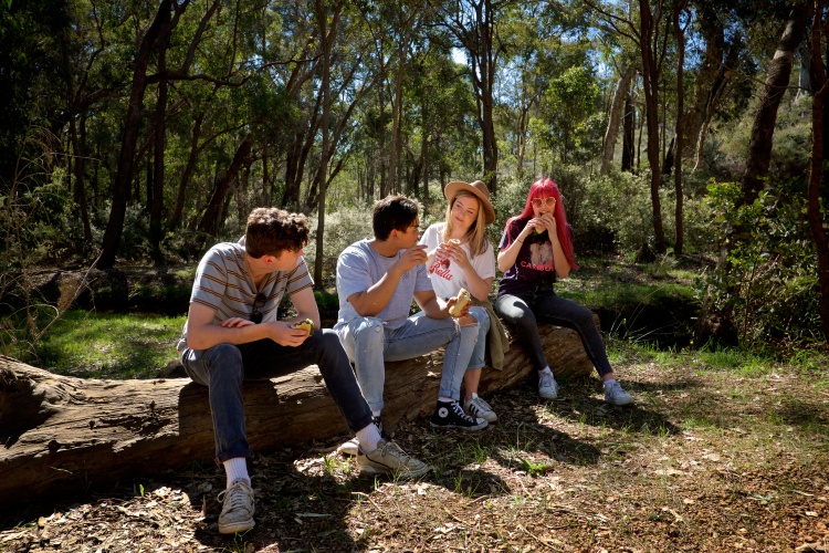 Youth hanging out in campsite